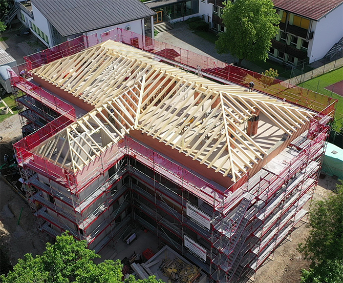 Neubau_eines_Mehrfamilienhauses_mit_14_Wohnungen_am_Chiemsee_Slide_01
